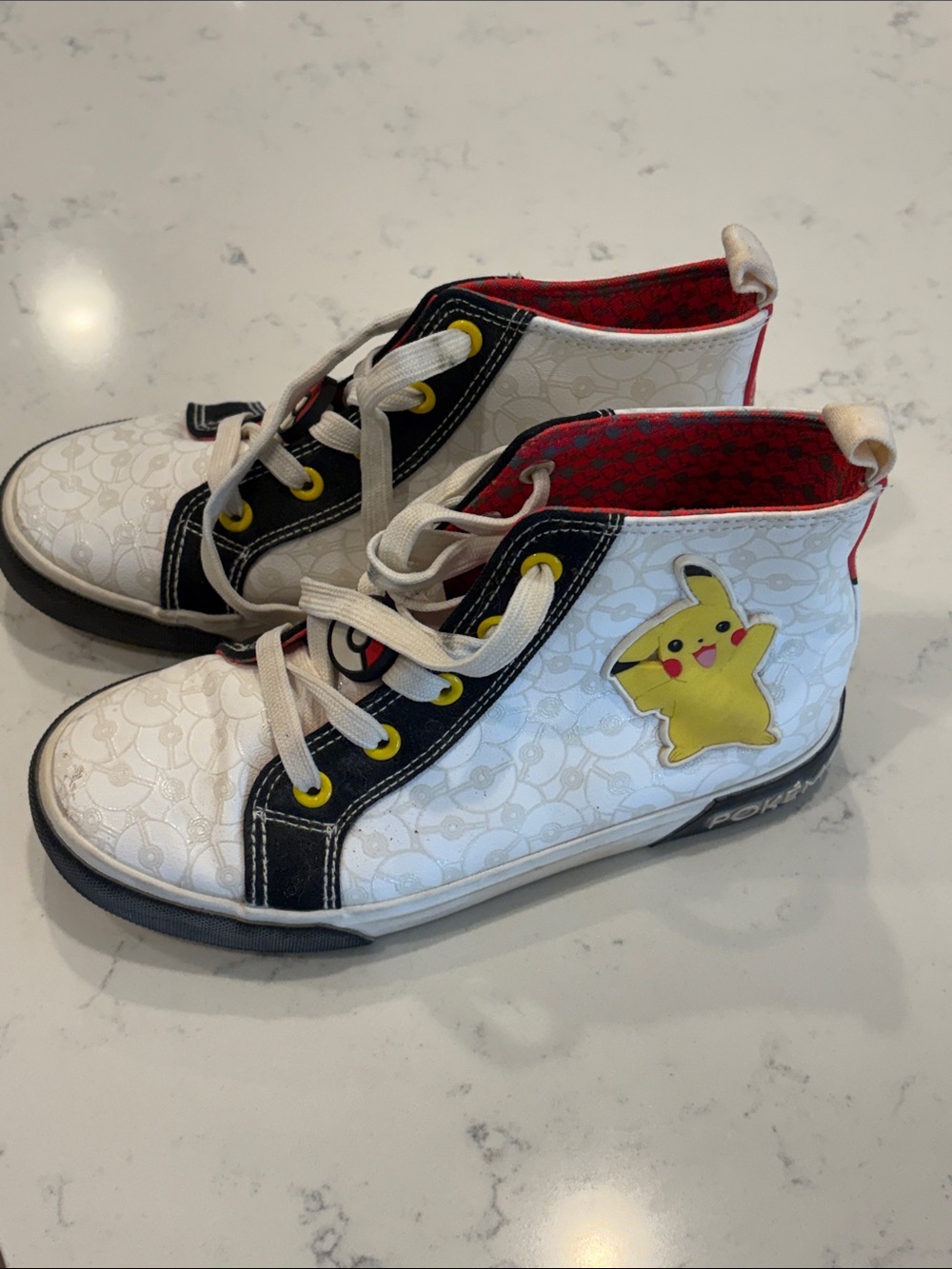 Pokemon White and Black Pikachu High-Top Sneakers with Yellow Accents